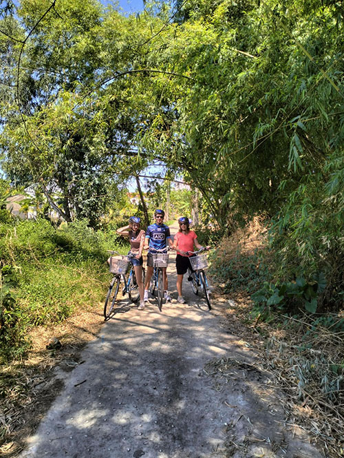 Friends cycling through native bamboo forests