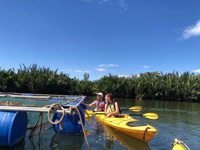 Hoian Kayak Tours guests exploring river life