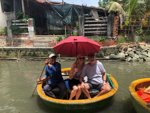 western couple in a bamboo basket boat