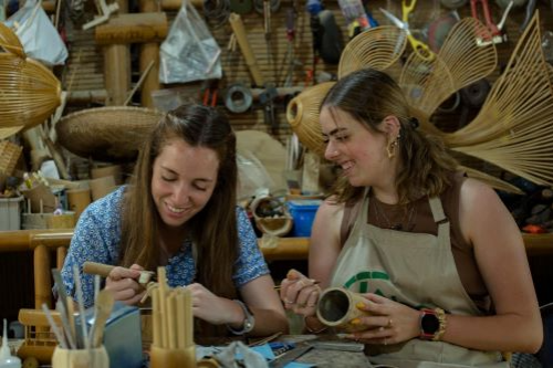 two young girl making craft in Bamboo workshop